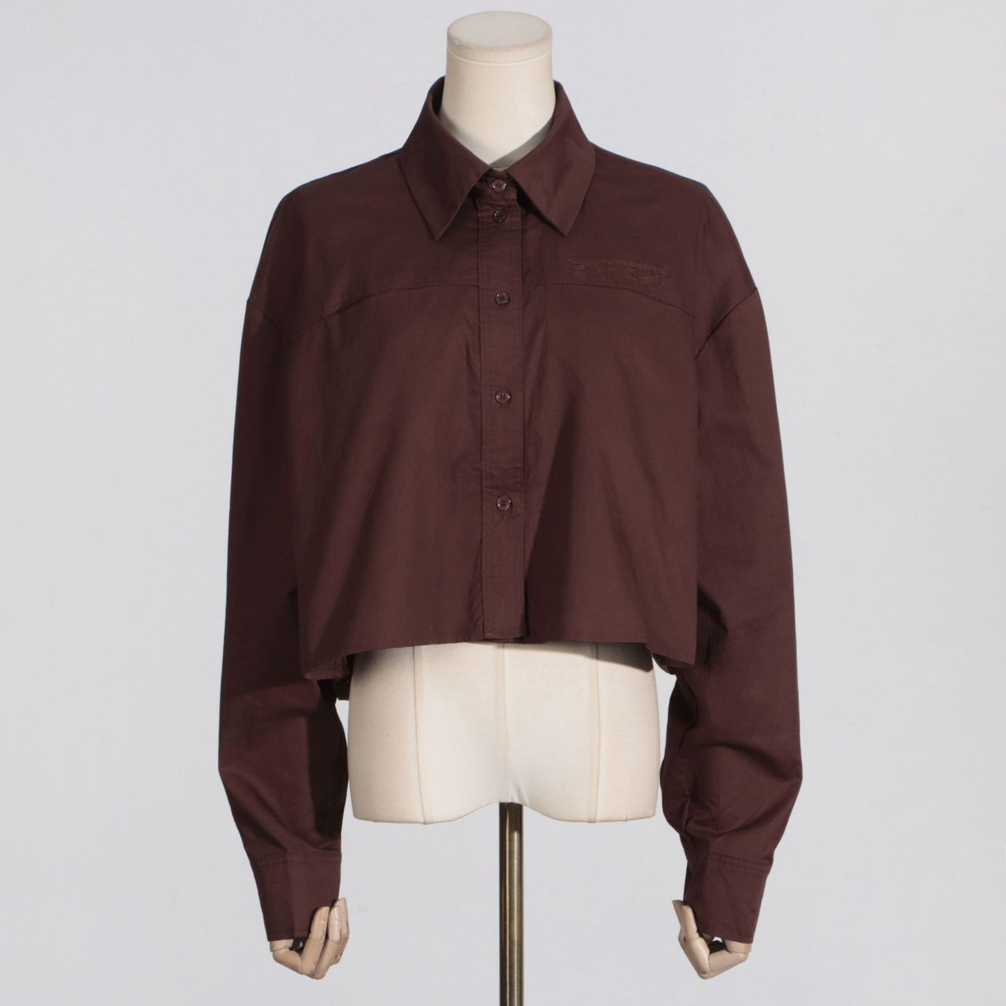 Minimalist style women's casual loose solid color long sleeved short shirt