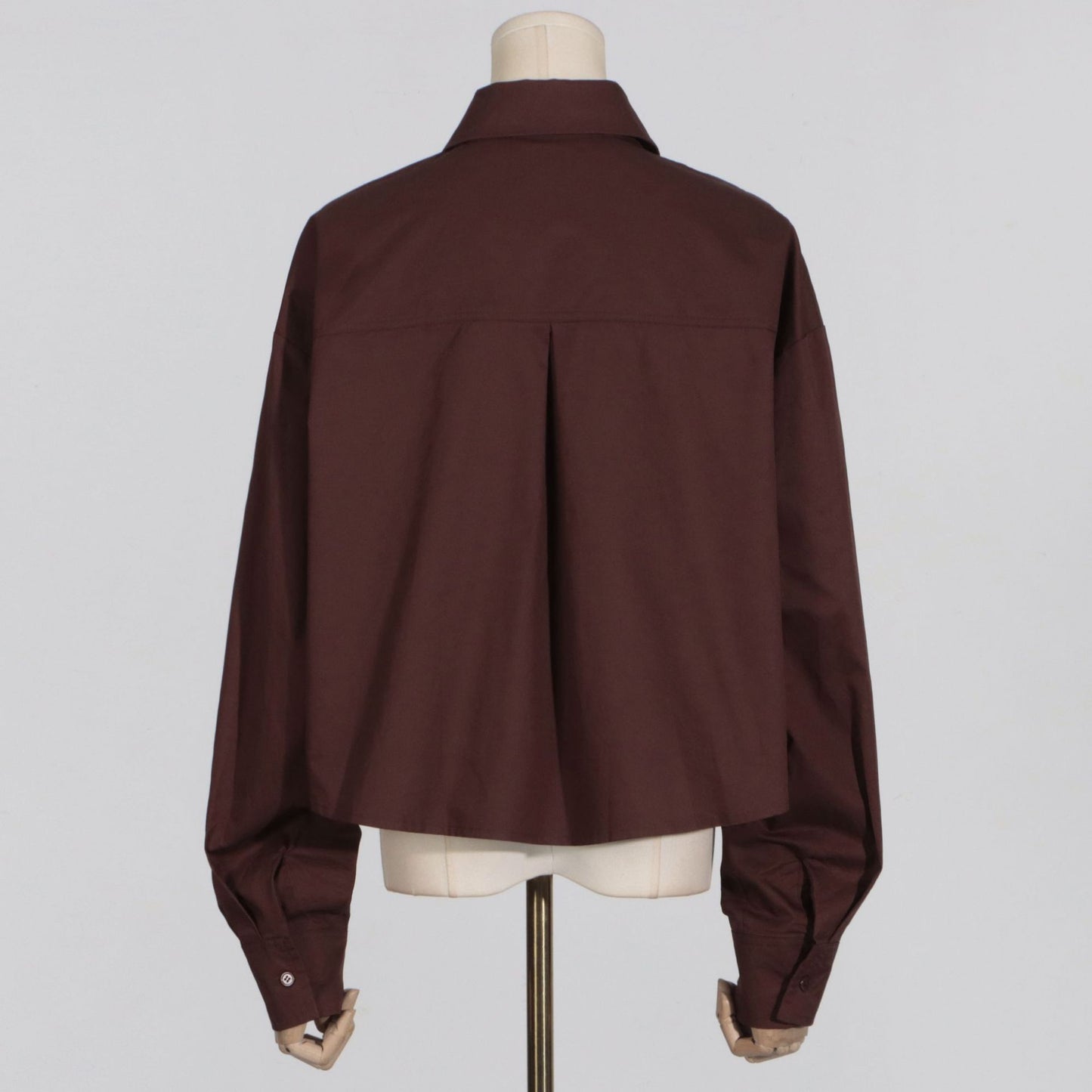Minimalist style women's casual loose solid color long sleeved short shirt
